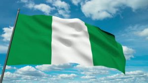 stock-footage-nigeria-flag-waving-against-time-lapse-clouds-background